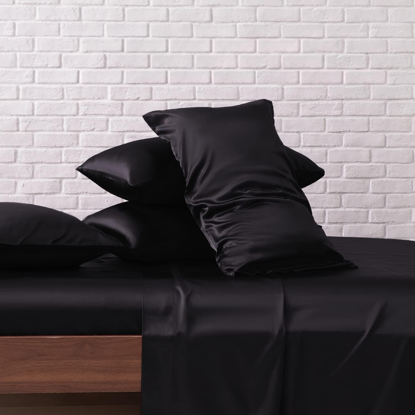 Black satin sheet set with matching pillowcases from CloudSatin Dream Bed Sheet Set.