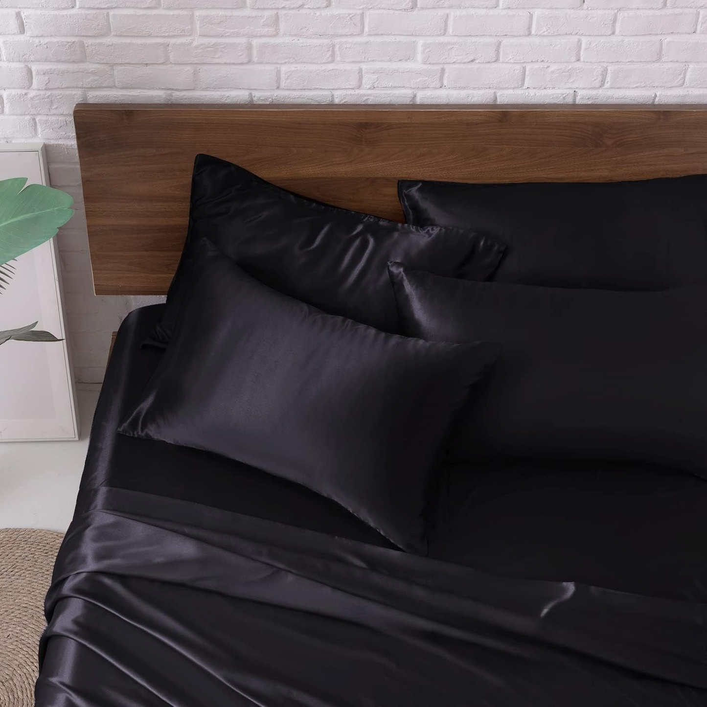 Luxurious black satin sheet set with coordinating pillowcases by CloudSatin Dream.